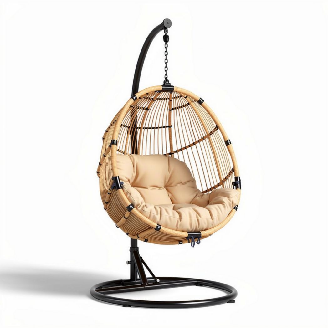 Hanging egg chair in natural rattan with cream cushion for indoor and outdoor use