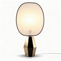 Table lamp with fabric shade and geometric base in black and gold finish 30 x 20 x 50cm
